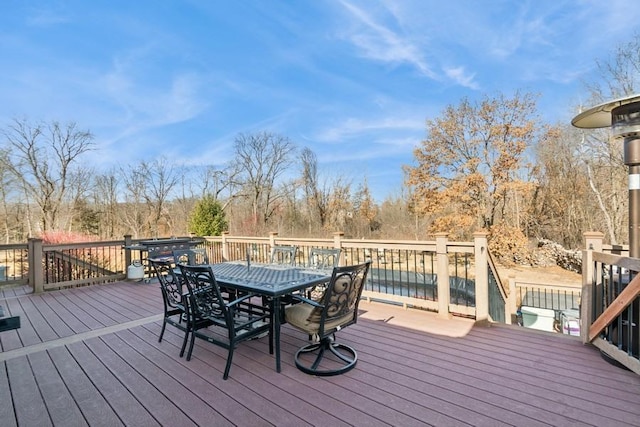 deck featuring outdoor dining area