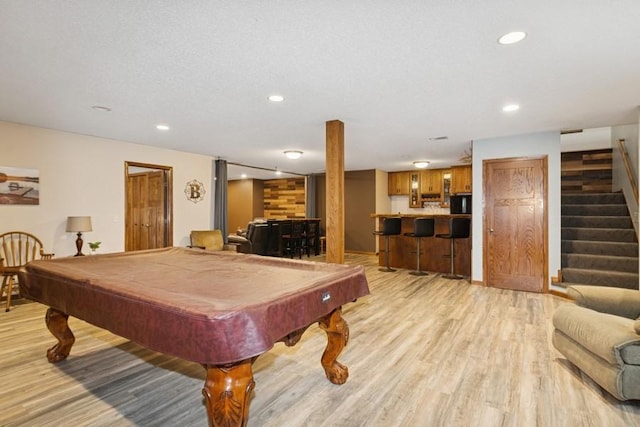 rec room with indoor wet bar, recessed lighting, pool table, and light wood-style floors