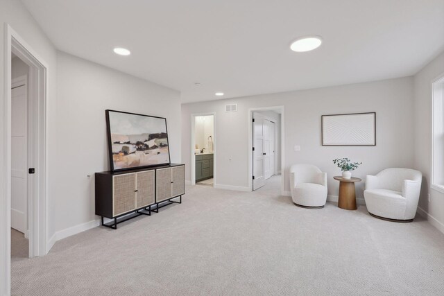 4640 Meadowview Ln, Minnetrista, MN 55331 - sitting room featuring light colored carpet and recessed lighting