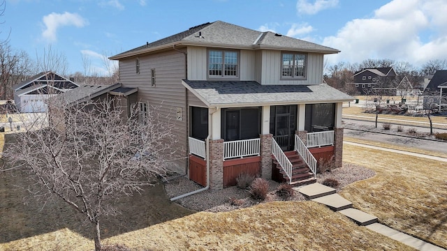 view of front of property featuring a shingled roof