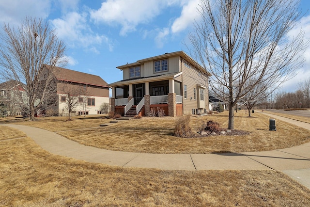 view of front of property with cooling unit and a porch