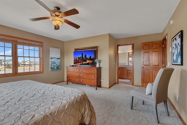 bedroom featuring light carpet, ceiling fan, a textured ceiling, and baseboards