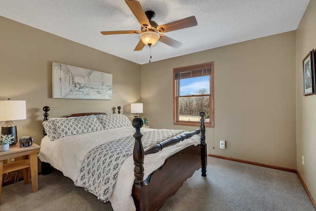 bedroom with a ceiling fan, carpet, baseboards, and a textured ceiling