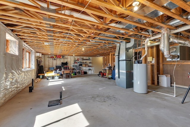 basement featuring gas water heater and heating unit