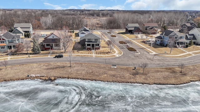 bird's eye view with a residential view and a wooded view