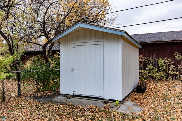 view of shed with fence