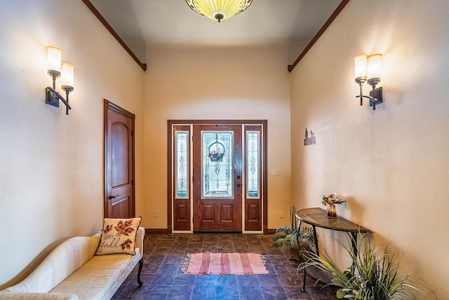 entrance foyer featuring stone finish floor and baseboards