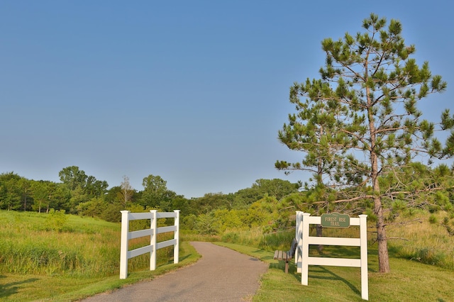 view of gate featuring fence