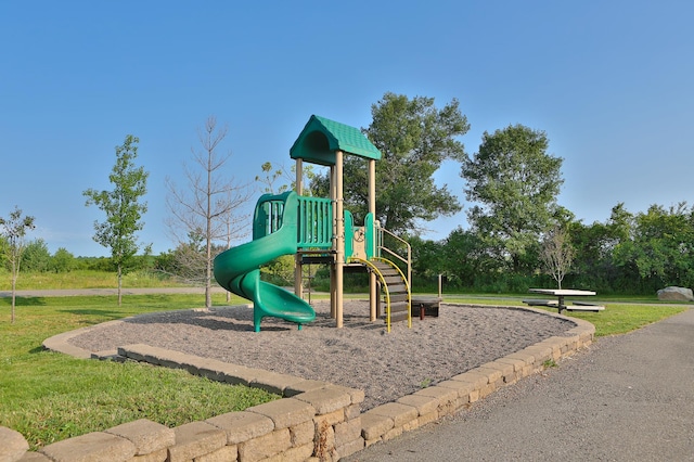 community jungle gym with a lawn