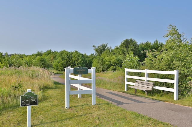 view of gate with fence