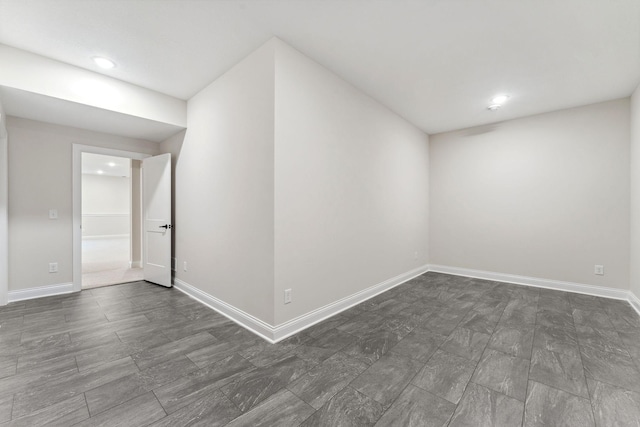 additional living space featuring baseboards