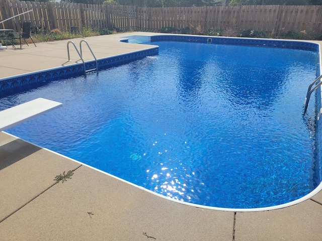 view of swimming pool with fence, a patio area, and a fenced in pool