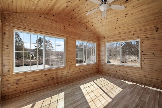 unfurnished sunroom with plenty of natural light, wooden ceiling, a ceiling fan, and vaulted ceiling