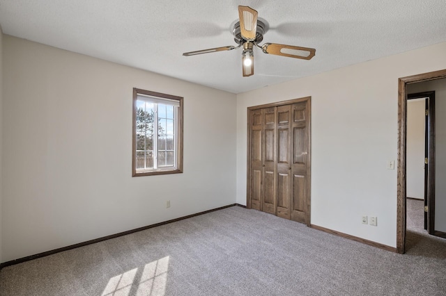 unfurnished bedroom featuring a closet, baseboards, and carpet