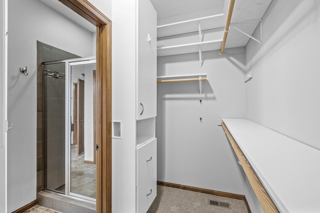 walk in closet featuring visible vents
