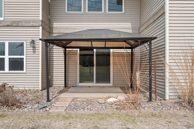property entrance featuring a patio