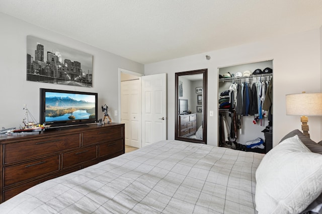 bedroom with a closet and a textured ceiling