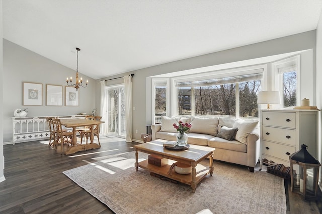 living room with dark wood-style floors, an inviting chandelier, baseboards, and lofted ceiling