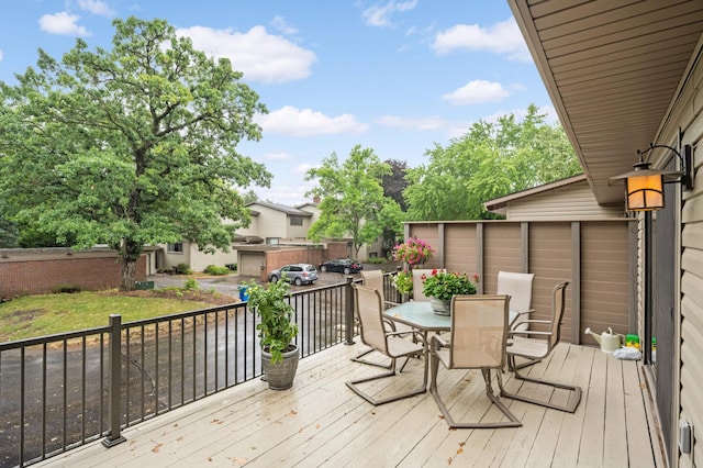 wooden terrace with outdoor dining area