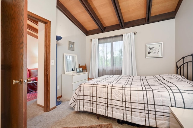 bedroom with wooden ceiling, carpet flooring, vaulted ceiling with beams, and baseboards