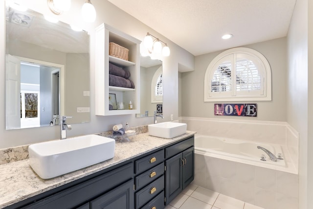 bathroom featuring a sink, plenty of natural light, and tile patterned flooring