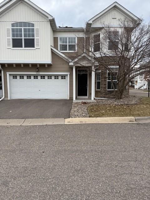 5640 Winnetka Ave N, New Hope, MN 55428 - traditional-style house featuring a garage and aphalt driveway