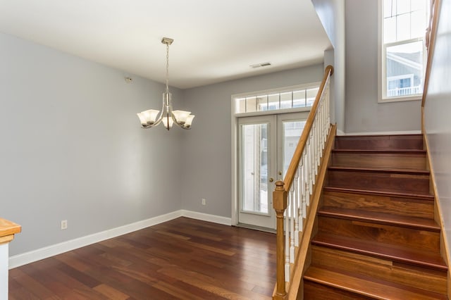 5640 Winnetka Ave N, New Hope, MN 55428 - entrance foyer with dark wood finished floors, visible vents, stairs, a notable chandelier, and baseboards