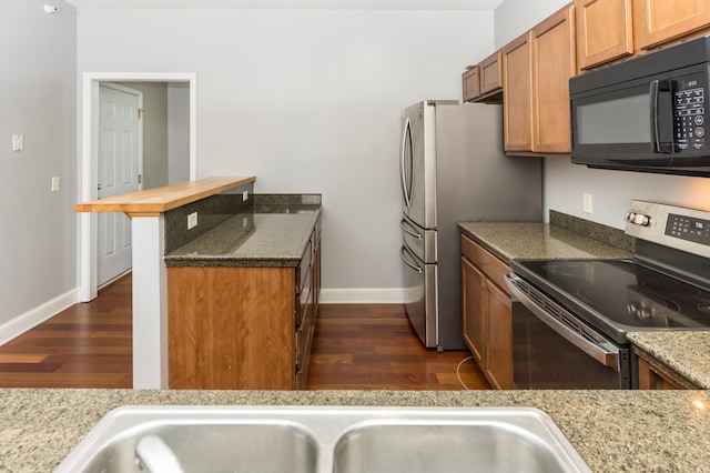 5640 Winnetka Ave N, New Hope, MN 55428 - kitchen with dark wood-type flooring, black microwave, baseboards, and stainless steel range with electric cooktop
