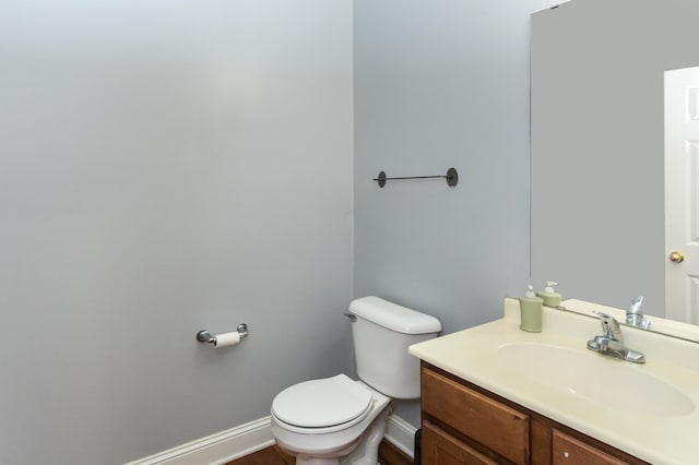 5640 Winnetka Ave N, New Hope, MN 55428 - bathroom with toilet, wood finished floors, vanity, and baseboards