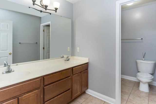 5640 Winnetka Ave N, New Hope, MN 55428 - full bath with tile patterned floors, double vanity, a sink, and toilet