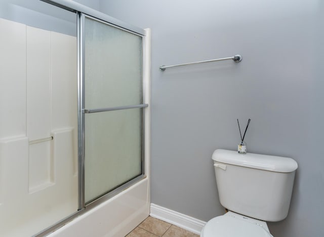 5640 Winnetka Ave N, New Hope, MN 55428 - full bath with tile patterned floors, shower / bath combination with glass door, baseboards, and toilet