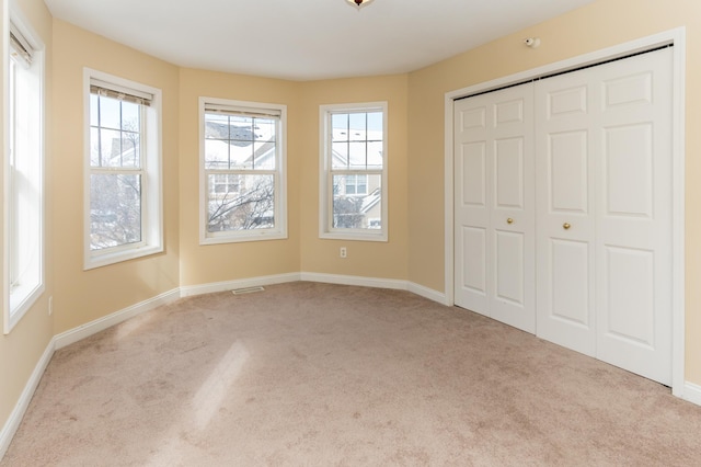 5640 Winnetka Ave N, New Hope, MN 55428 - unfurnished bedroom featuring a closet, visible vents, baseboards, and carpet