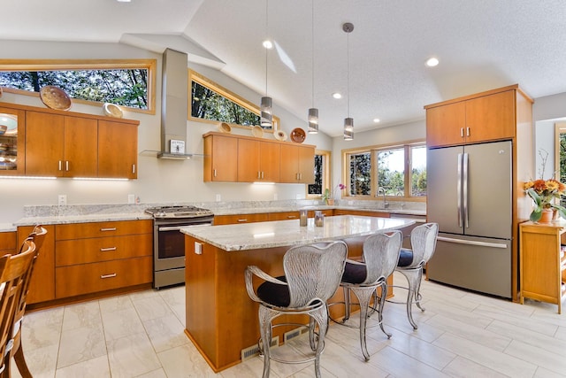 1950 Park Ridge Ct, Chaska, MN 55318 - kitchen with appliances with stainless steel finishes, vaulted ceiling, brown cabinetry, light stone counters, and recessed lighting