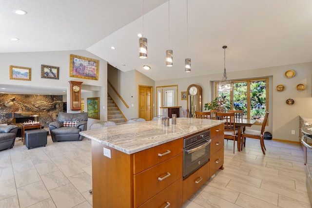 1950 Park Ridge Ct, Chaska, MN 55318 - kitchen featuring vaulted ceiling, oven, open floor plan, light marble finish flooring, and a kitchen island