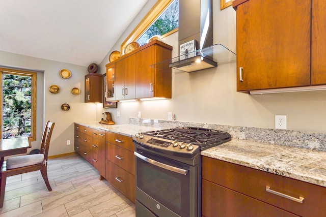 1950 Park Ridge Ct, Chaska, MN 55318 - kitchen with stainless steel range with gas cooktop, wall chimney range hood, vaulted ceiling, brown cabinets, and light stone countertops
