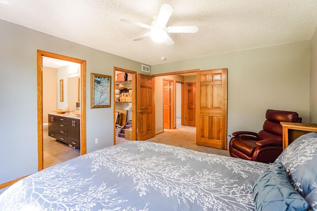 1950 Park Ridge Ct, Chaska, MN 55318 - bedroom featuring a textured ceiling, ensuite bathroom, and ceiling fan