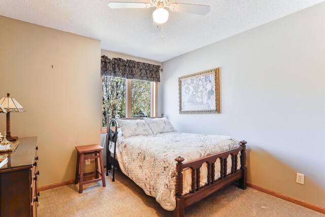 1950 Park Ridge Ct, Chaska, MN 55318 - bedroom with light carpet, baseboards, a textured ceiling, and ceiling fan