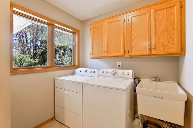 1950 Park Ridge Ct, Chaska, MN 55318 - laundry area featuring washing machine and clothes dryer and cabinet space
