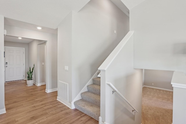 12273 71st Ct NE, Otsego, MN 55330 - stairs featuring baseboards, recessed lighting, and wood finished floors