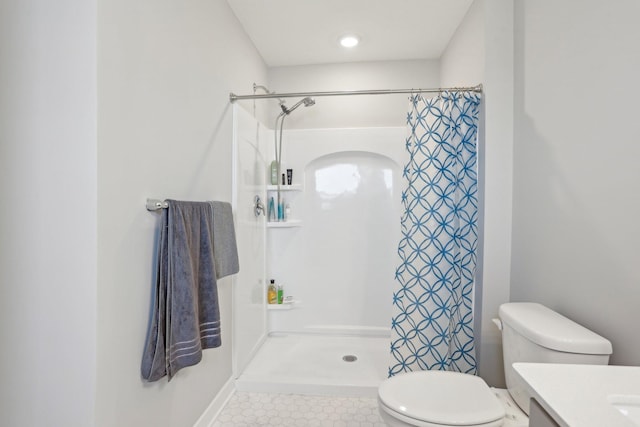 12273 71st Ct NE, Otsego, MN 55330 - bathroom featuring a stall shower, toilet, vanity, and tile patterned floors