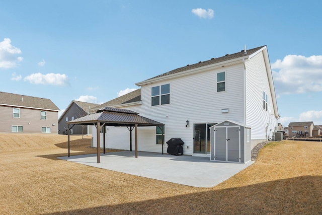 12273 71st Ct NE, Otsego, MN 55330 - rear view of house with a gazebo, a patio, a yard, and central air condition unit