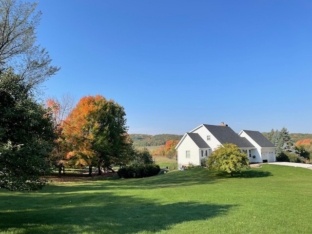 view of yard featuring an attached garage