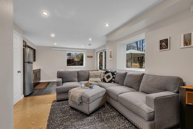 living room with baseboards and recessed lighting