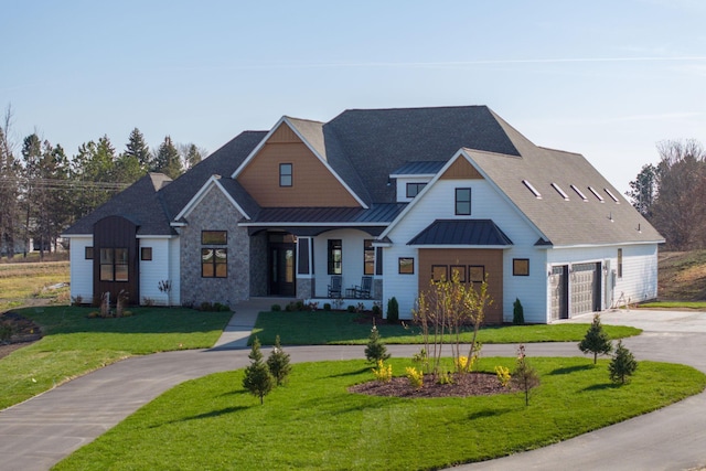 modern farmhouse featuring curved driveway, a front lawn, metal roof, a garage, and a standing seam roof