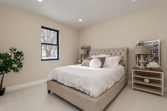 bedroom featuring recessed lighting, baseboards, and light colored carpet