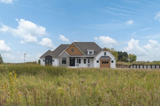 view of front of house featuring a garage and metal roof