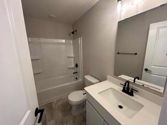 bathroom with shower / bath combination, vanity, and toilet