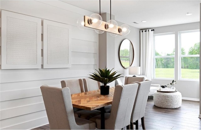 dining room with wood-type flooring, visible vents, baseboards, and recessed lighting