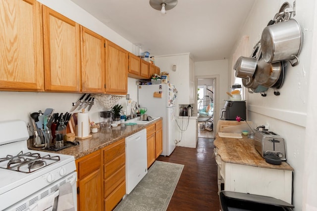 kitchen featuring dark wood-style floors and white appliances