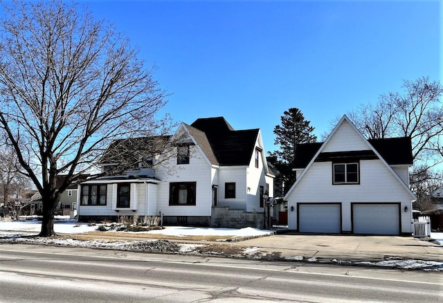 view of front of house featuring central AC and driveway